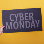 female hand holding a cyber monday poster studio 2026 01 09 00 37 16 utc
