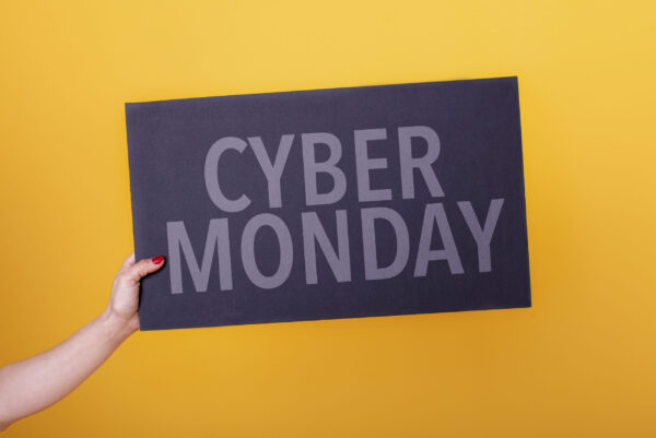 female hand holding a cyber monday poster studio 2026 01 09 00 37 16 utc