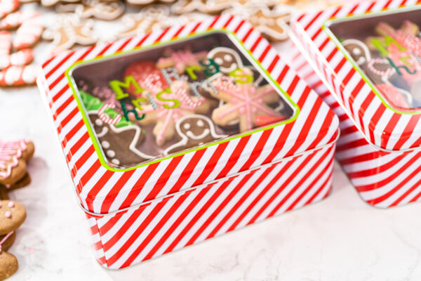 festive cookies in striped christmas tins on table 2026 01 08 02 15 32 utc