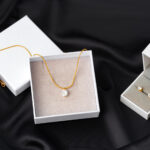 golden necklace on silk texrtile background close 2026 03 23 23 51 52 utc