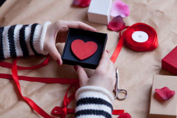 hands preparing a heart gift with ribbon 2026 01 05 04 37 33 utc
