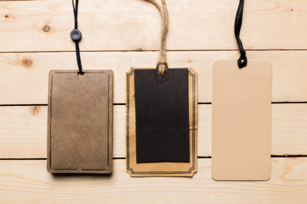 hanging tags for merchandise on wooden background 2026 03 09 02 56 18 utc