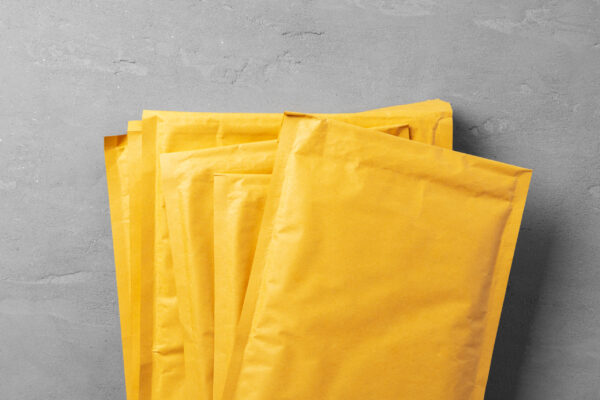 lot of yellow paper postal envelopes top view 2026 03 19 07 48 58 utc