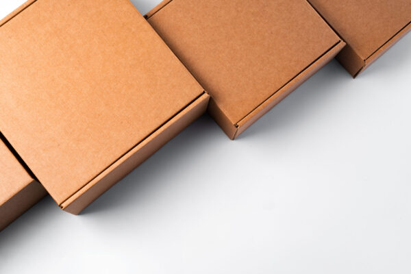 minimalist brown cardboard boxes on white surface 2026 03 20 03 30 09 utc