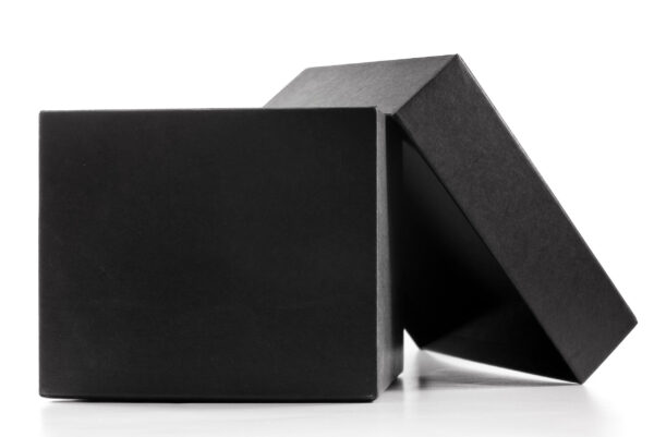 open black box on white surface close up 2026 03 25 04 03 12 utc