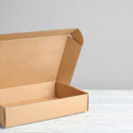 open brown cardboard box on white wooden surface 2026 03 27 17 27 02 utc