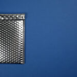 padded envelope with bubble wrap on blue backgroun 2026 03 27 00 54 37 utc