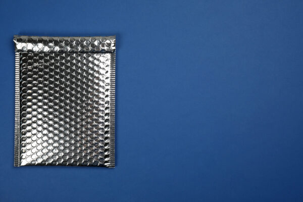 padded envelope with bubble wrap on blue backgroun 2026 03 27 00 54 37 utc