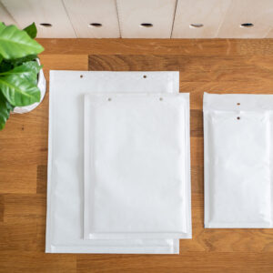 padded mailing envelopes on a wooden desk 2026 03 26 07 46 08 utc