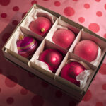 shiny red christmas ornaments in a box 2026 03 26 03 48 08 utc