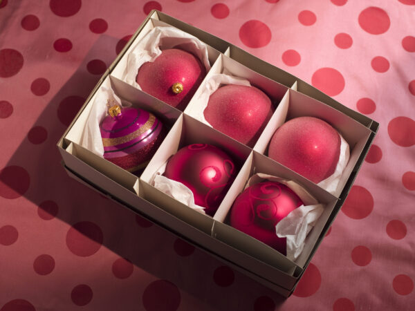 shiny red christmas ornaments in a box 2026 03 26 03 48 08 utc