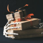 spooky gifts held by skeleton hands for halloween 2026 03 20 03 12 48 utc