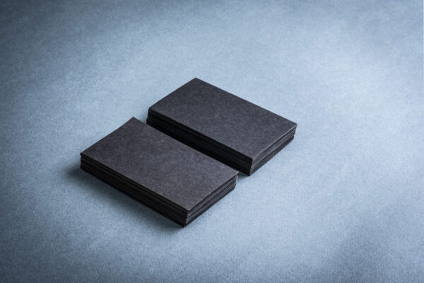 stacks of dark business cards on gray background 2026 03 20 04 46 30 utc