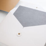 top view of blank grey card in white envelop with 2026 03 13 04 19 46 utc