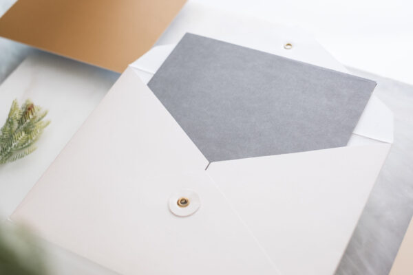 top view of blank grey card in white envelop with 2026 03 13 04 19 46 utc
