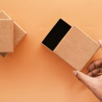 top view of person open a empty small gift box 2026 03 16 03 03 19 utc