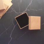 top view of person open a empty small gift box 2026 03 16 06 29 36 utc