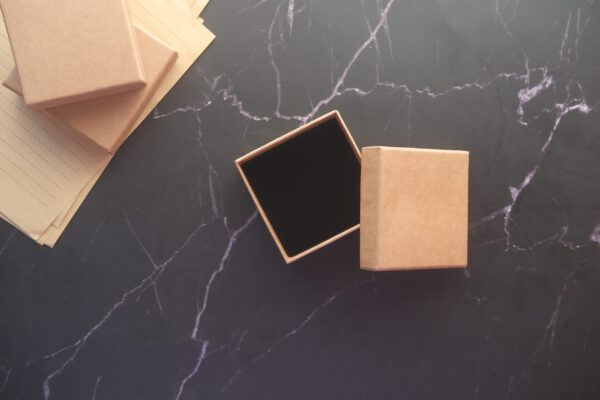 top view of person open a empty small gift box 2026 03 16 06 29 36 utc