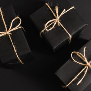 top view of wrapped dark gift boxes on black 2026 01 05 23 39 29 utc