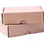 two brown cardboard boxes stacked on white backgro 2026 03 25 04 26 00 utc