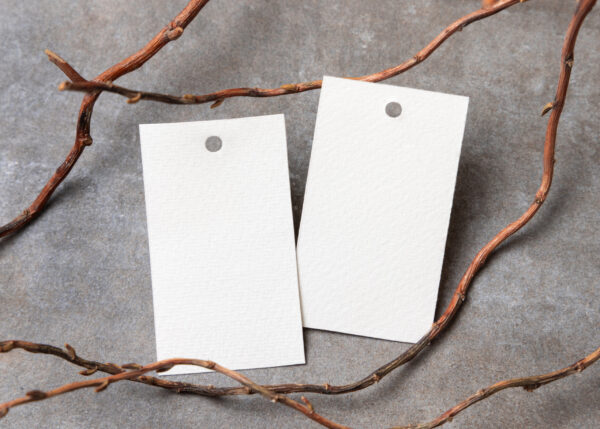 two white tags with branch on gray background 2026 04 17 17 28 58 utc