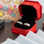 wedding rings in a red box with cosmetics 2026 03 18 09 33 21 utc