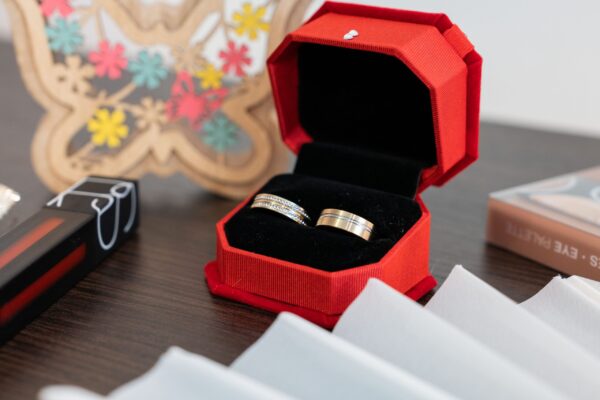 wedding rings in a red box with cosmetics 2026 03 18 09 33 21 utc