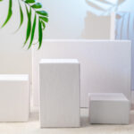 white geometric shapes with green fronds for produ 2026 03 17 17 36 26 utc