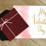 wrapped gift and valentine s day card on table 2026 01 07 23 35 55 utc