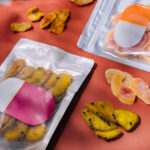 dried tropical fruits in bags on orange background 2026 03 27 00 53 35 utc