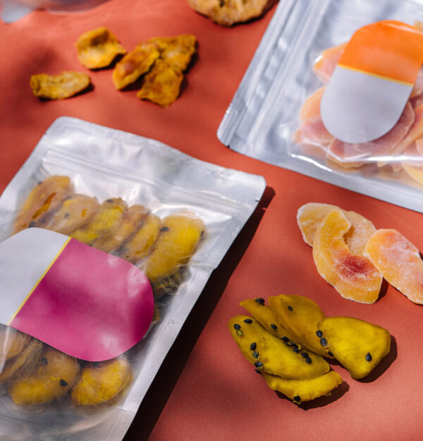 dried tropical fruits in bags on orange background 2026 03 27 00 53 35 utc