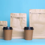 coffee cups and packaging against a blue backgroun 2026 03 18 04 23 04 utc