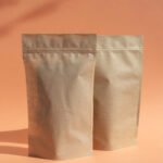 two brown paper bags against a peach background 2026 03 16 02 08 06 utc