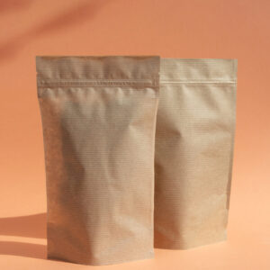 two brown paper bags against a peach background 2026 03 16 02 08 06 utc