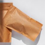 two brown paper pouches on white surface 2026 03 17 00 07 49 utc